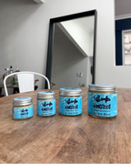 Four jars of natural vegan deodorant Azure Blue on a wooden table